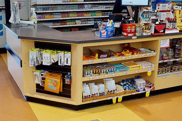 DisplayMax team designed and installed front sales counter showcasing custom retail fixture design.