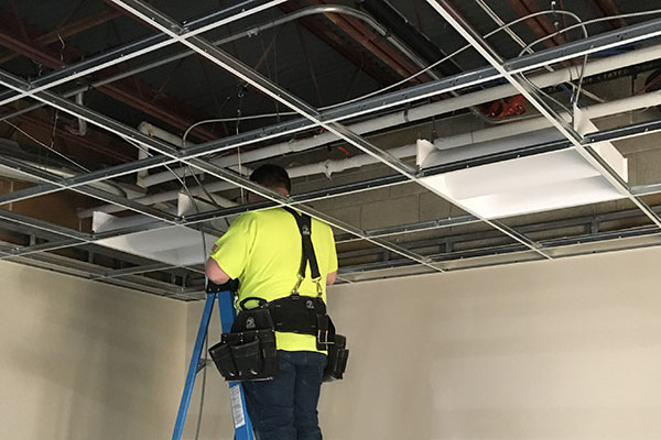 The DisplayMax electrical team, installing lights in a new store setup