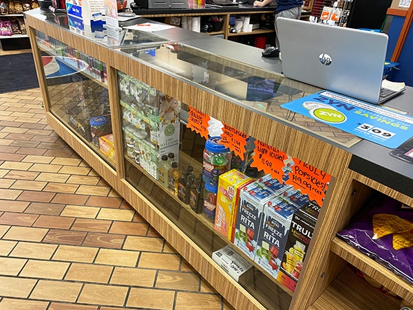 Liquor Store Setup- A retail display of glass display cases, designed and installed by DisplayMax team