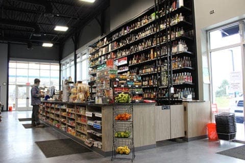 DisplayMax team designed and installed checkout counter showcasing custom retail fixture design.