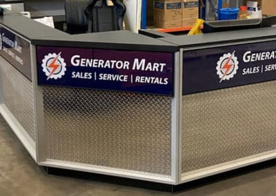 DisplayMax team–installed Generator Mart front sales counter showcasing custom retail fixture design.