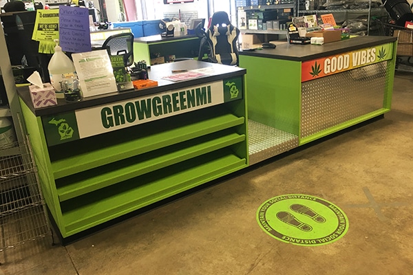 DisplayMax team–installed front sales counter showcasing custom retail fixture design.